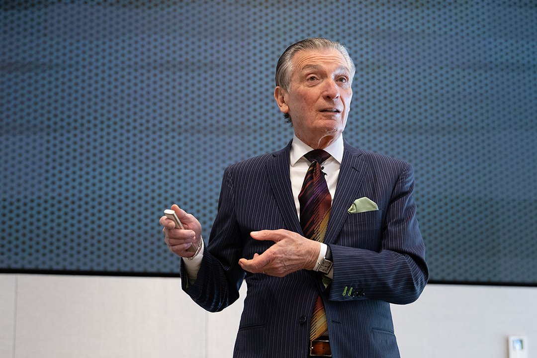 MIT Professor Emeritus Don Sadoway is animated and talking in front of a presentation.